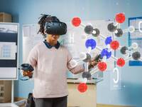 Girl using VR headset to look at structure of a molecule